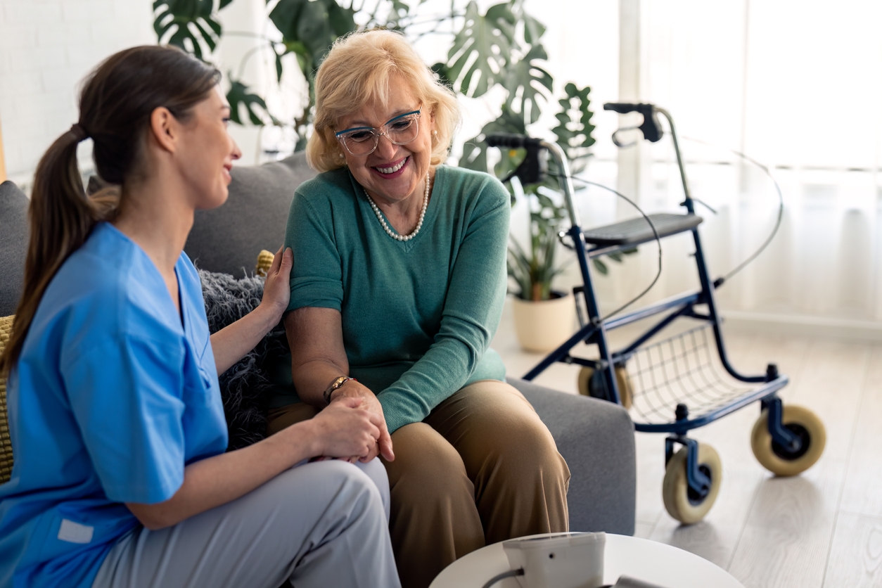Caregiver supporting an older adult at home